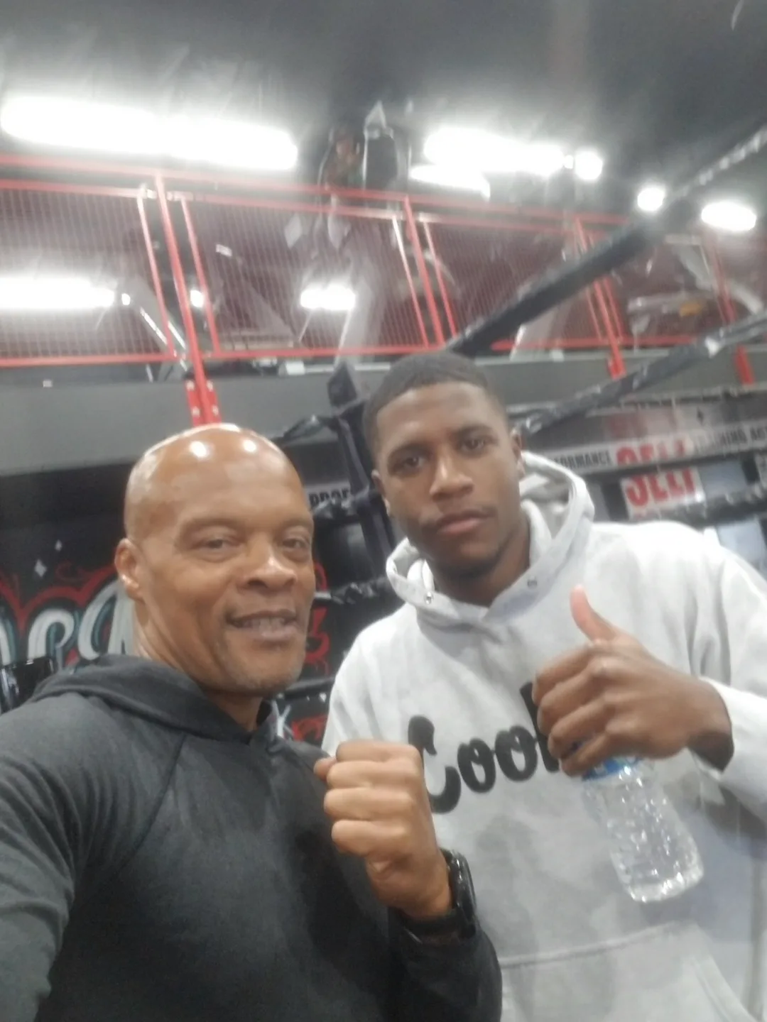 Coach Bizz with one of his young fighters at the gym