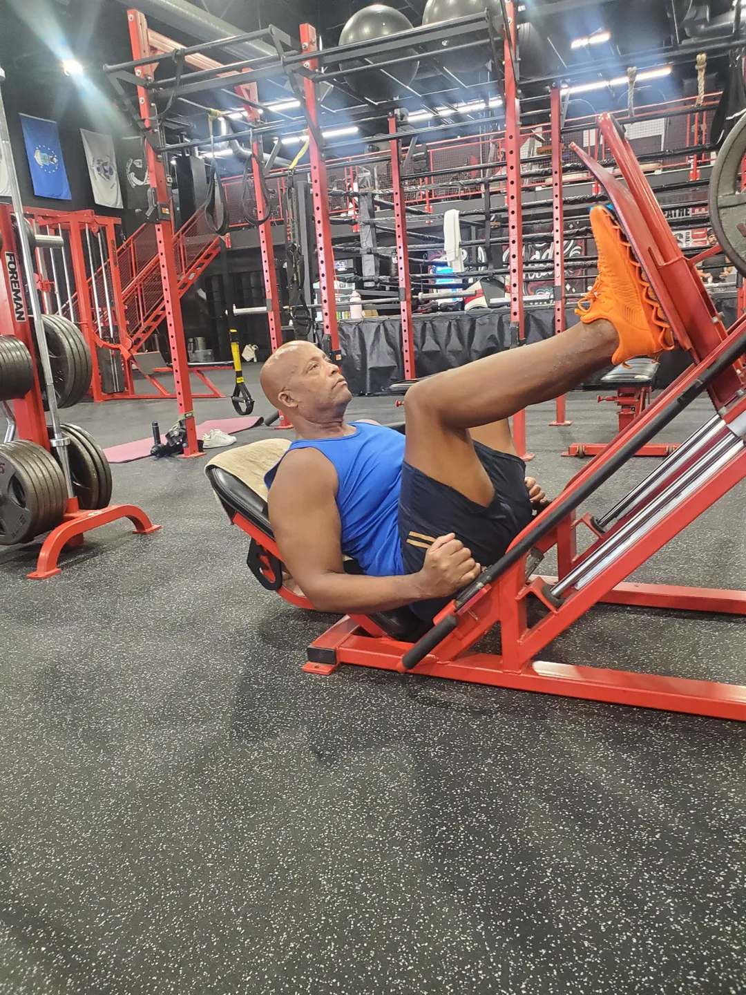 A BizzFit client driving the leg press