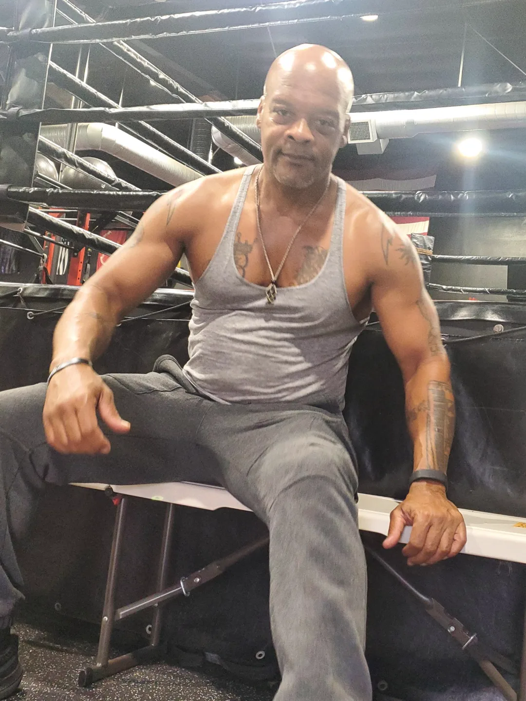 Coach Bizz ringside between rounds at the gym