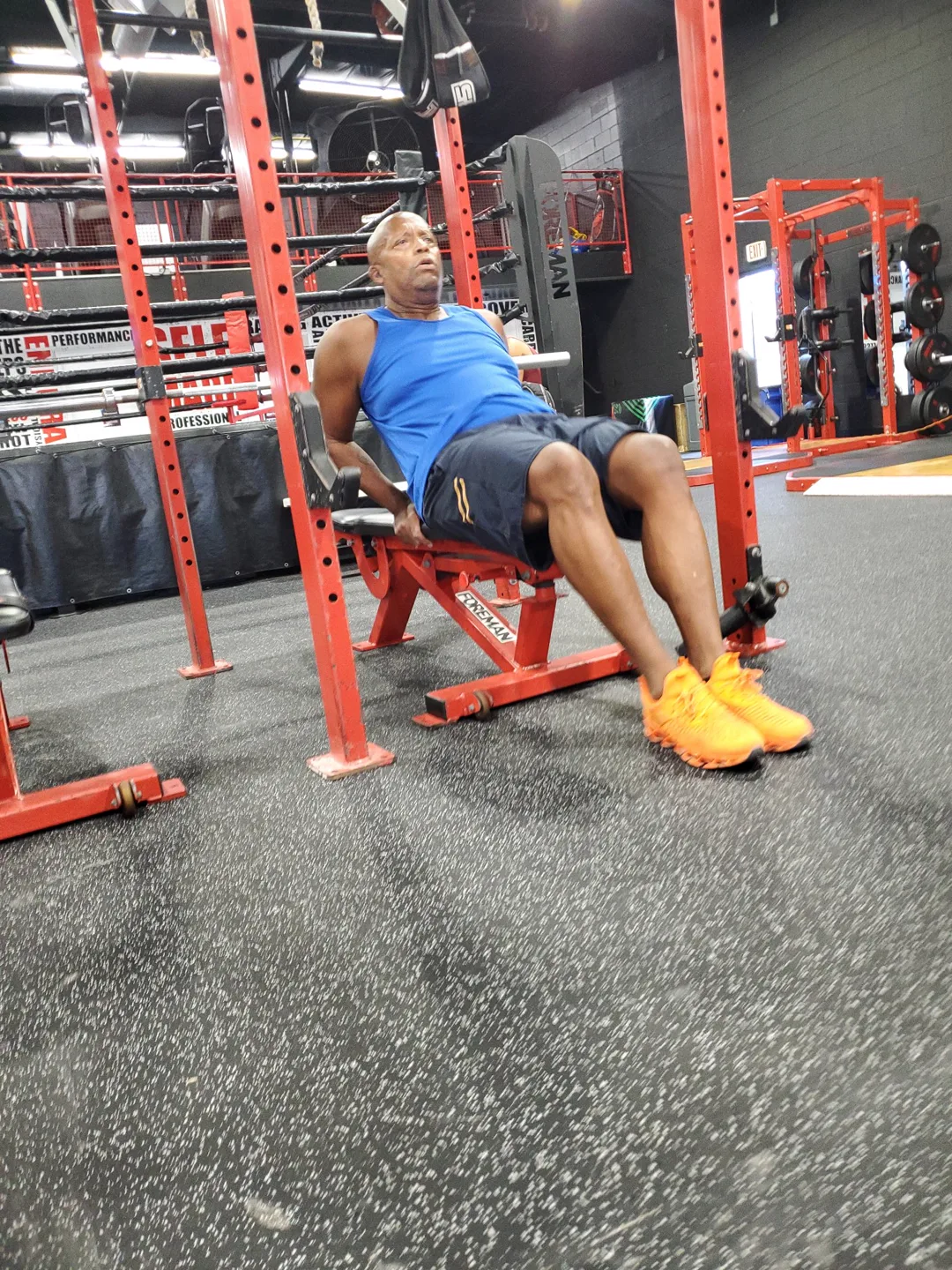 A BizzFit client mid-workout on the bench at Legacy Performance Institute